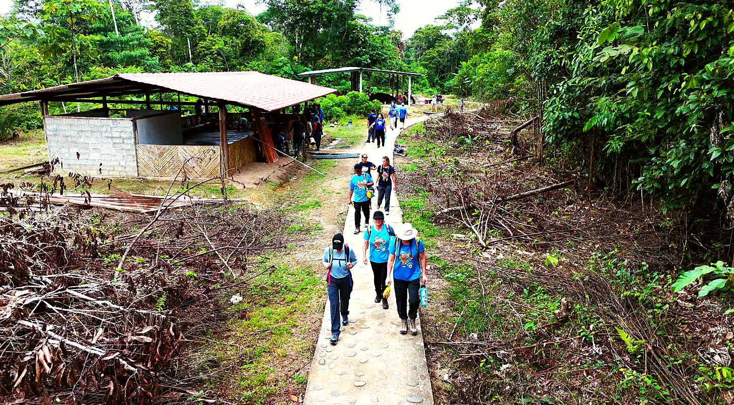 Volunteers walking the concrete path to the work sites