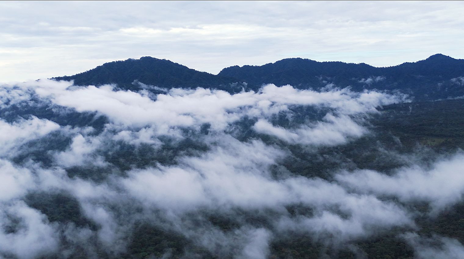 Clouds settled between the peaks of the Andes
